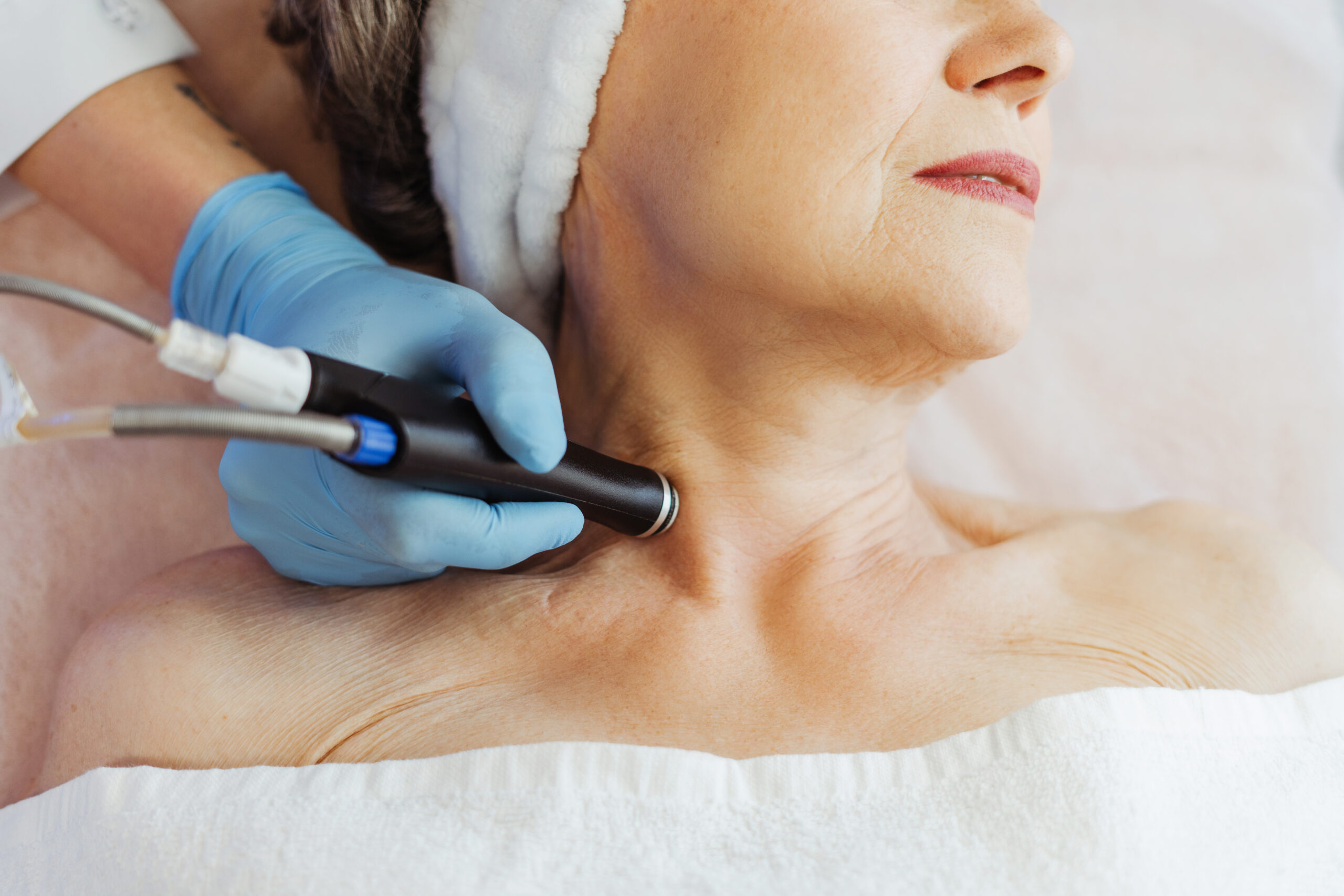 Dermatologist performing neck rejuvenation treatment at Couture Dermatology Beverly Hills