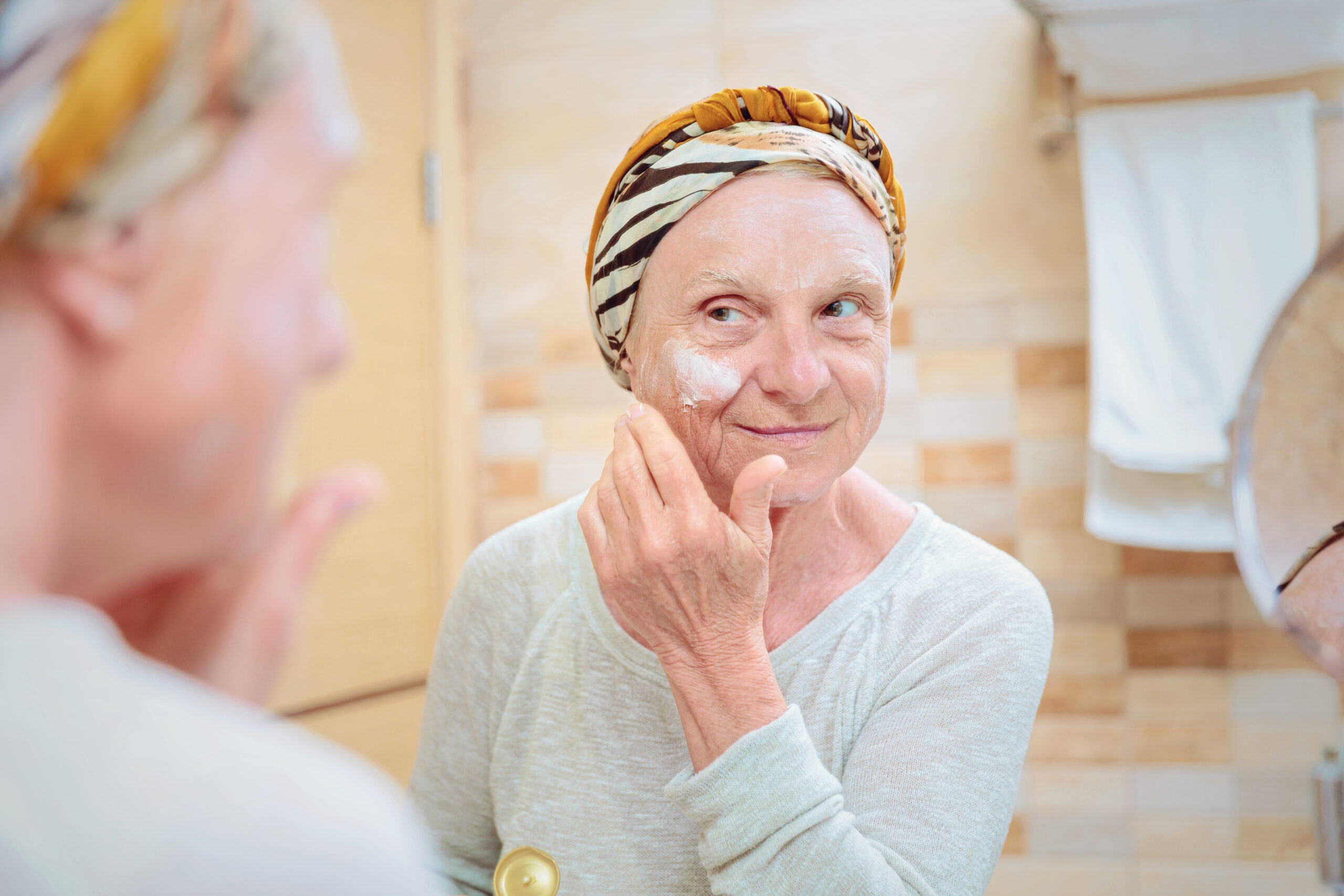 Woman with smooth skin after wrinkle softening treatment at Couture Dermatology